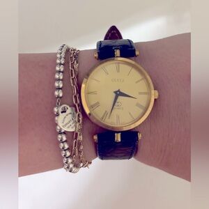 Vintage Gucci gold and navy blue band watch
